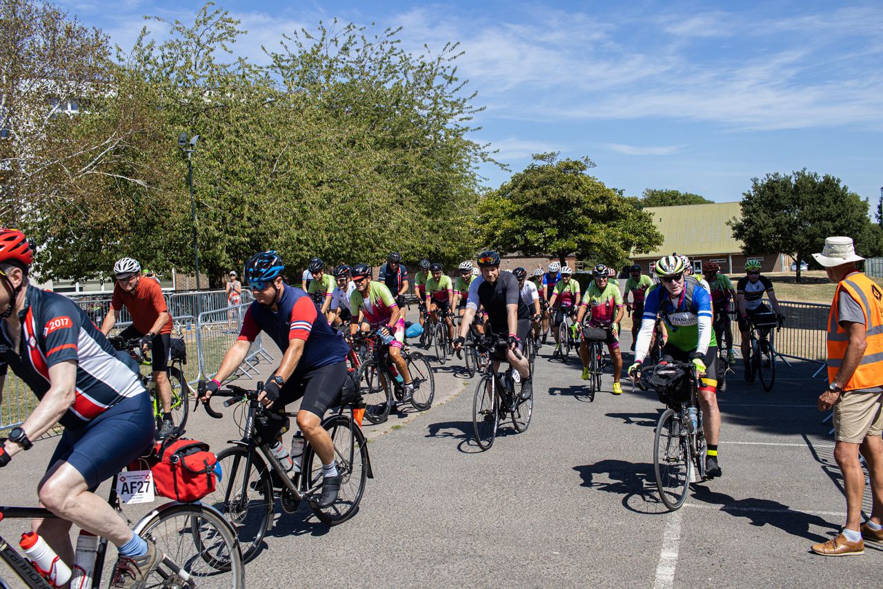 A group of riders departs Debden at the start of London-Edinburgh-London in 2022