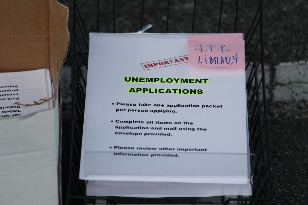 Unemployment applications are seen as City of Hialeah employees hand them out to people in front of the John F. Kennedy Library on April 08, 2020 in Hialeah, Florida.