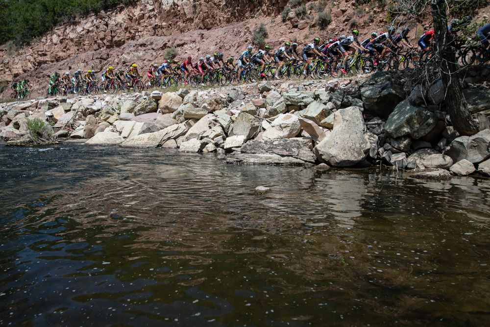 Riders pass a river along today's route