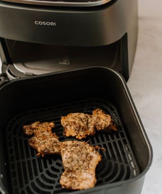 Cooked chicken breast in COSORI TurboBlaze air fryer basket