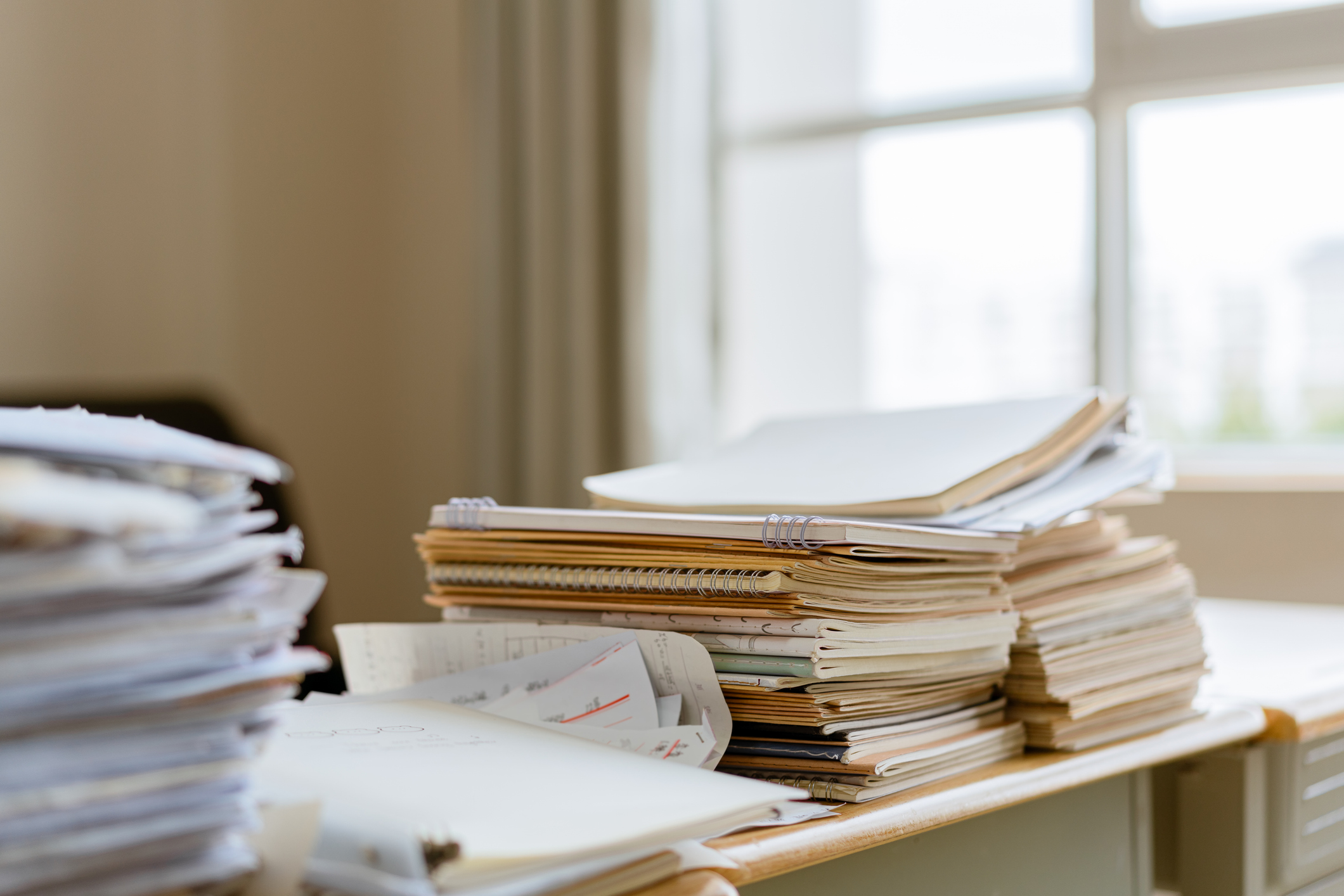 Stacks of paper on a desk