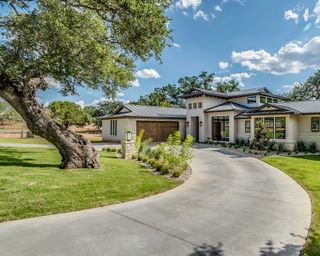 modern curved driveway around tree