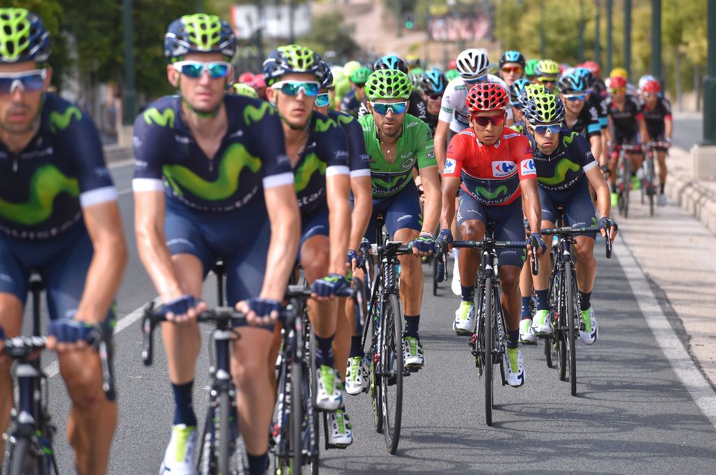 The Movistar team looking after Alejandro Valverde in green and Nairo Quintana in red