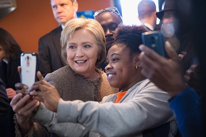 Hillary Clinton takes a selfie with a fan.