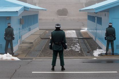 Soldiers stand guard at the DMZ.