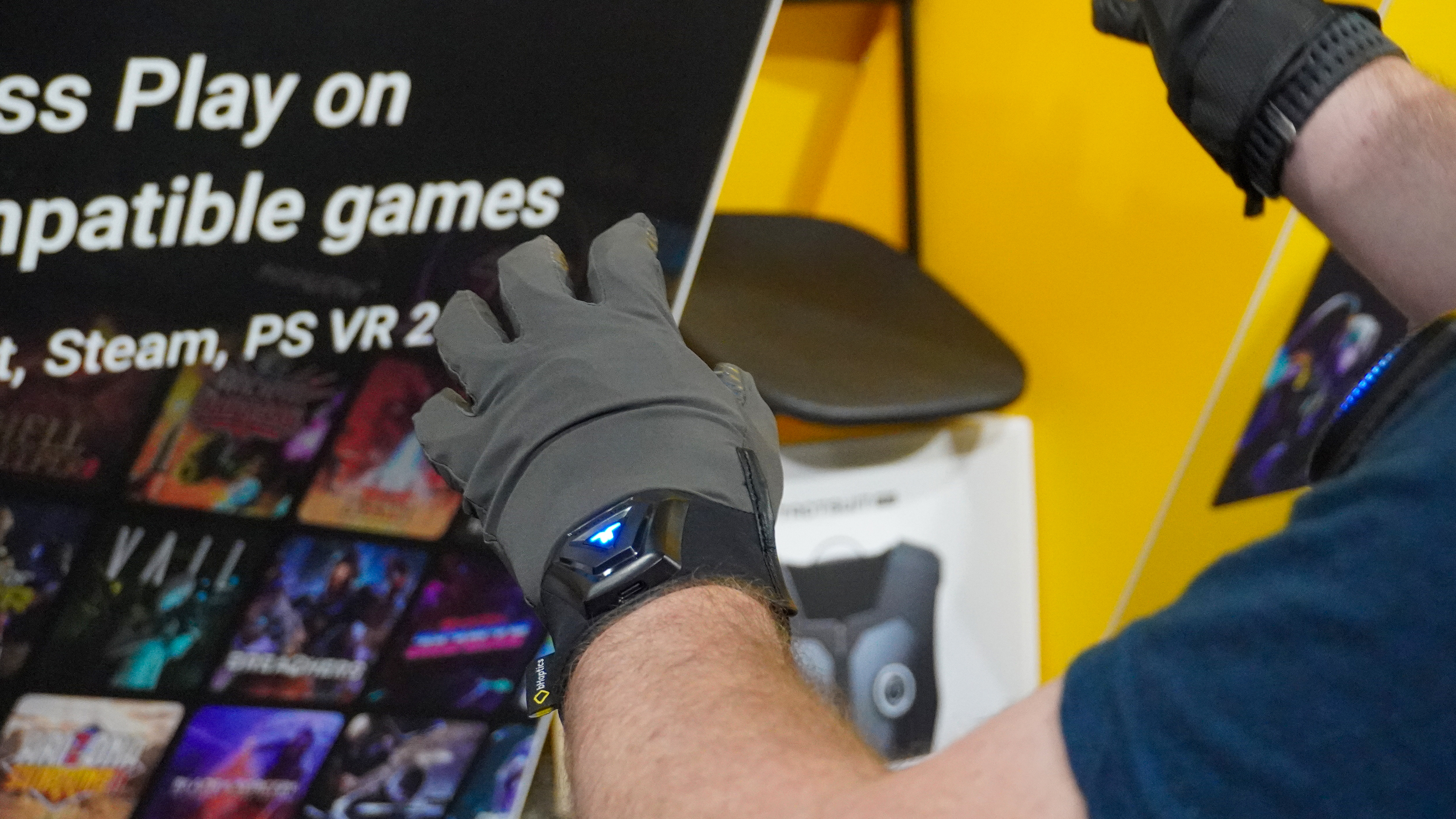 bHaptics Vr accessories: vest, gloves, sleeve with Meta headset at AWE 2025