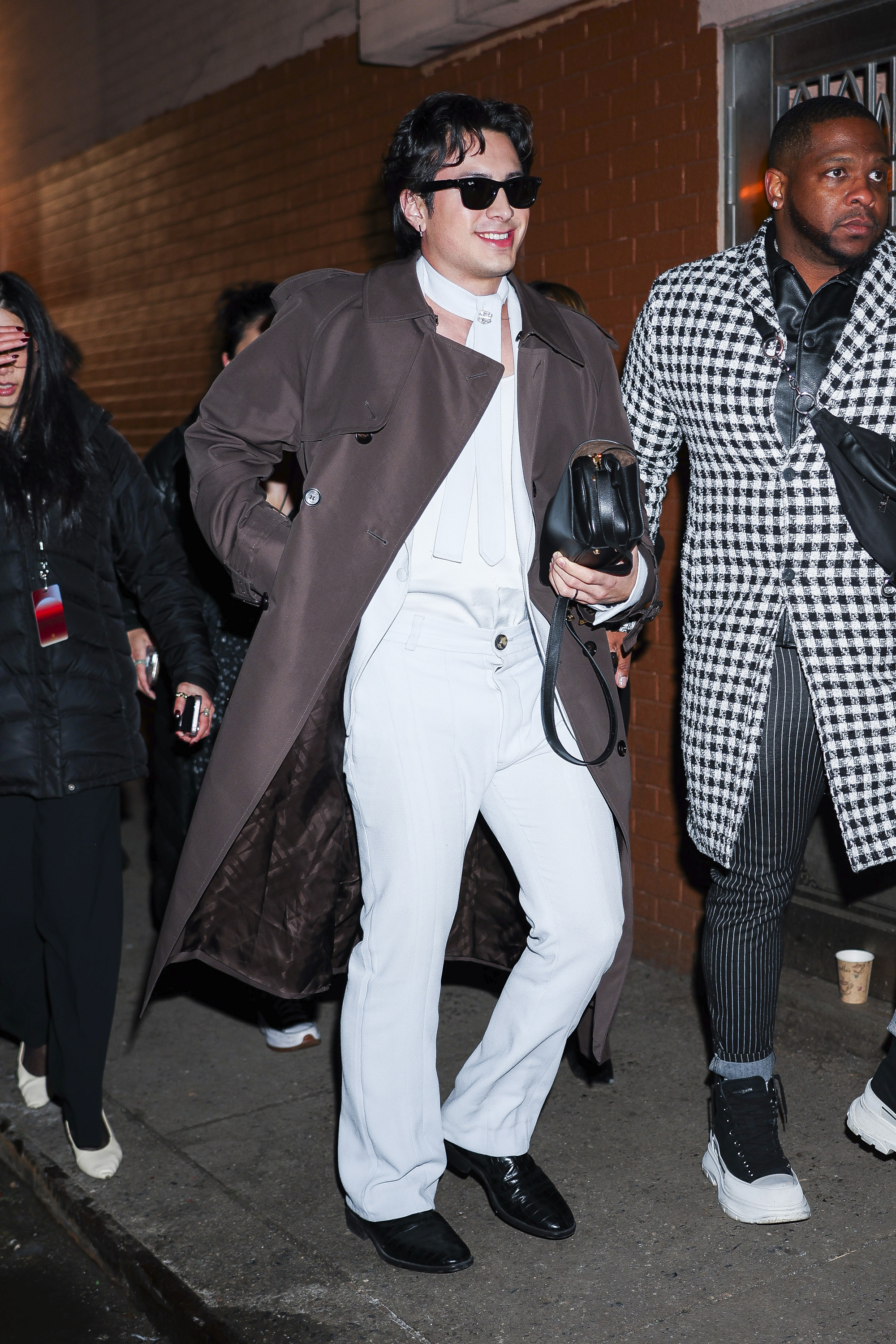 Hudson Williams attended a New York Fashion Week party in an all white silk look and a matching tie