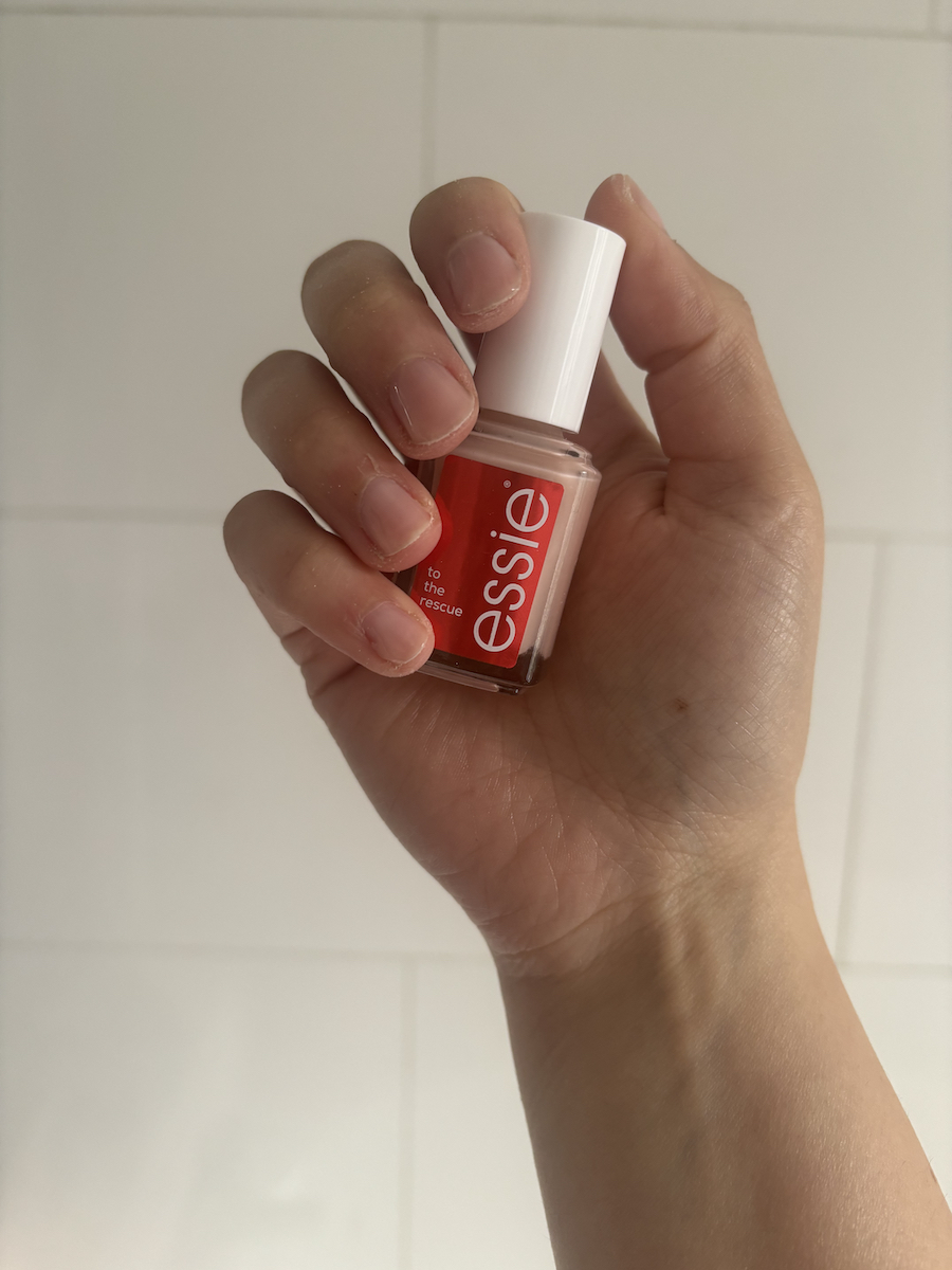 Mica Ricketts holding bottle of Essie To The Rescue
