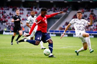 Jonathan Christian David #9 of Lille OSC shoots the ball during the UEFA Europa Conference League match between LOSC Lille and NK Olimpija Ljubljana at Stade Pierre-Mauroy on September 20, 2023 in Lille, France.
