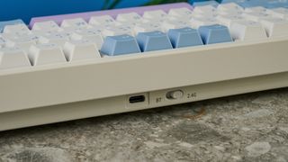 A pink, blue and white Gamakay TK75 Pro wireless mechanical keyboard with hot-swappable linear switches