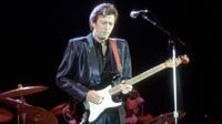 Eric Clapton plays his Blackie Strat onstage in the mid '80s. He auctioned the Strat off in 2004 to support the Crossroads rehab centre in Antigua.
