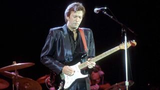 Eric Clapton plays his Blackie Strat onstage in the mid '80s. He auctioned the Strat off in 2004 to support the Crossroads rehab centre in Antigua.