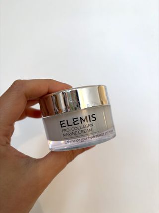 Mica Ricketts holding pot of Elemis Pro-Collagen Marine Cream