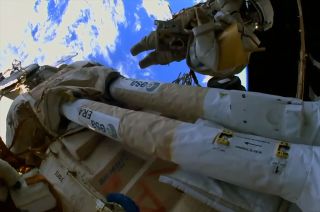 The European Robotic Arm (ERA) is seen outside of the International Space Station, mounted as it was for its launch on the side of the Nauka multi-purpose laboratory module. A series of spacewalks is planned to configure the arm for use.