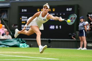 Marketa Vondrousova of Czech Republic plays a forehand in the Women's Singles semifinals match against Elina Svitolina of Ukraine during day eleven of The Championships Wimbledon 2023 at All England Lawn Tennis and Croquet Club on July 13, 2023 in London, England. 