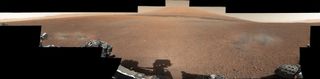 This color panorama shows a 360-degree view of the landing site of NASA's Curiosity rover, including the highest part of Mount Sharp visible to the rover. That part of Mount Sharp is approximately 12 miles (20 kilometers) away from the rover. Scientists enhanced the color in one version to show the Martian scene as it would appear under the lighting conditions we have on Earth, which helps in analyzing the terrain. Photo released August 27, 2012.
