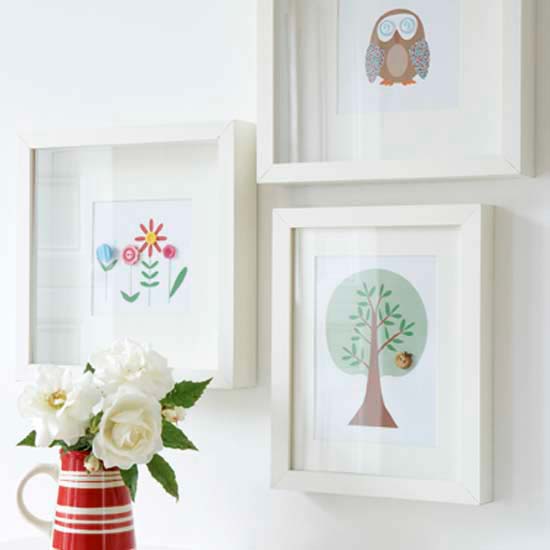white wall with frames on it