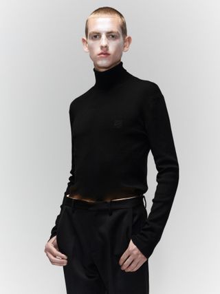 Model wears black roll-neck by Loewe A/W 2022 menswear