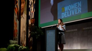 Melinda Gates speaks on stage at a 'Women Deliver' event.