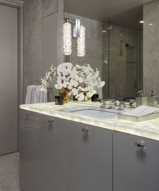neutral powder room with mirror