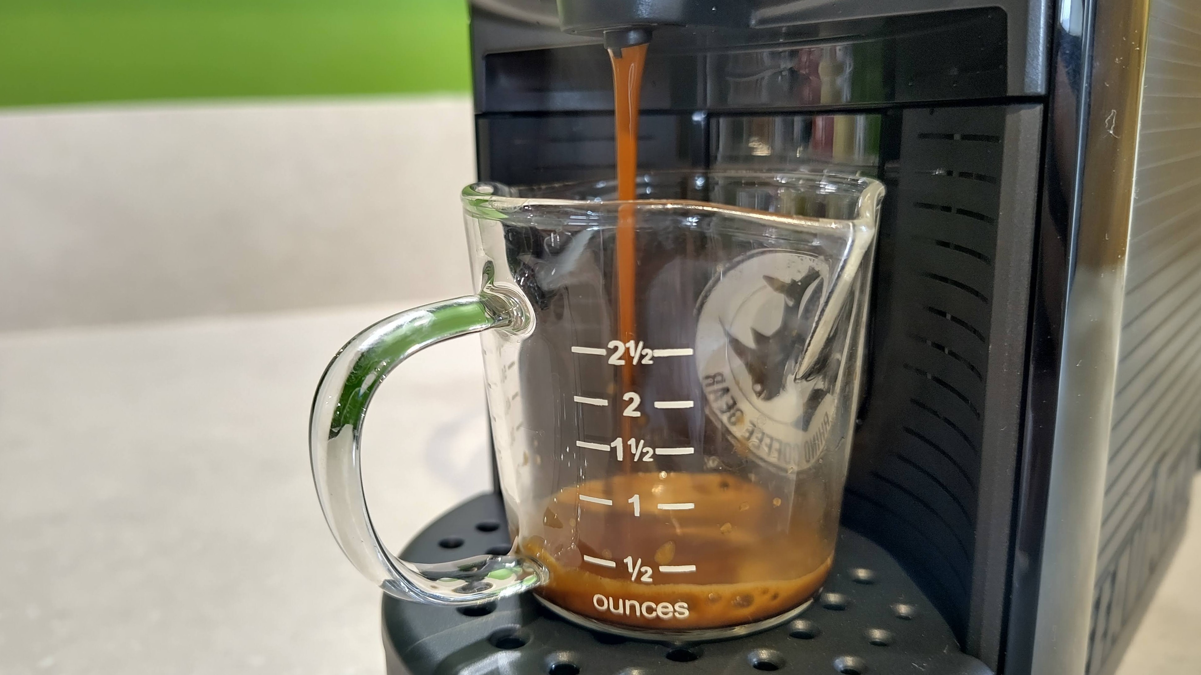 Lavazza Jolie Evo coffee maker dispensing espresso