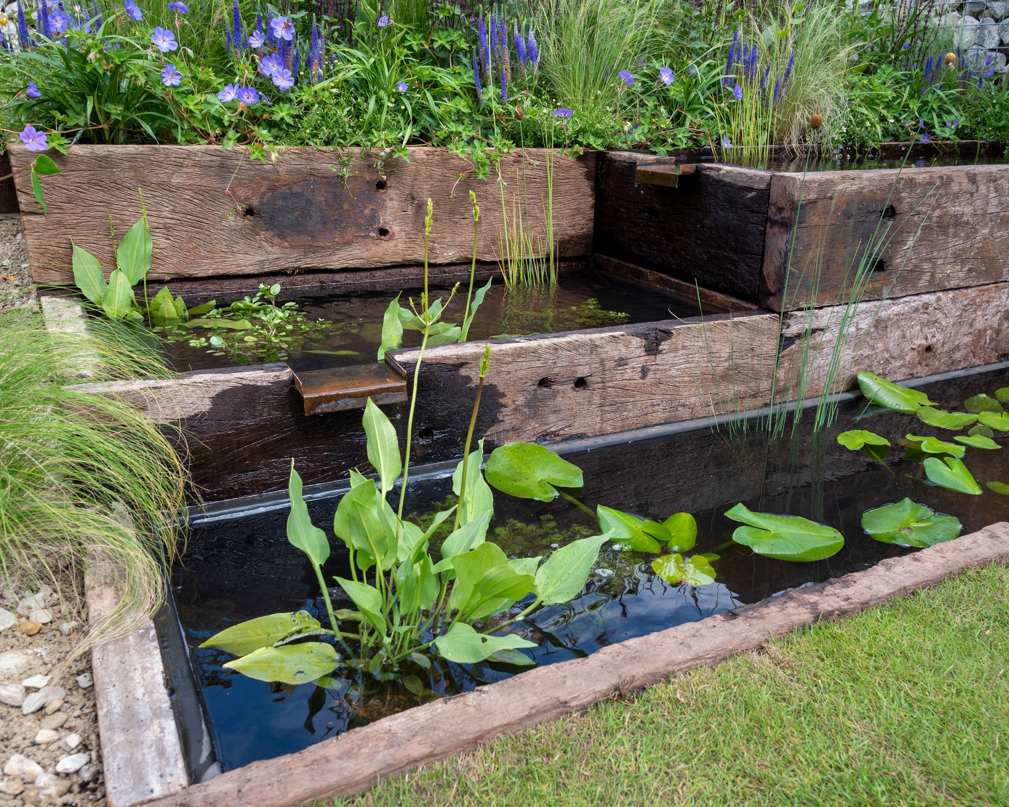 series of ponds encased in railway sleepers