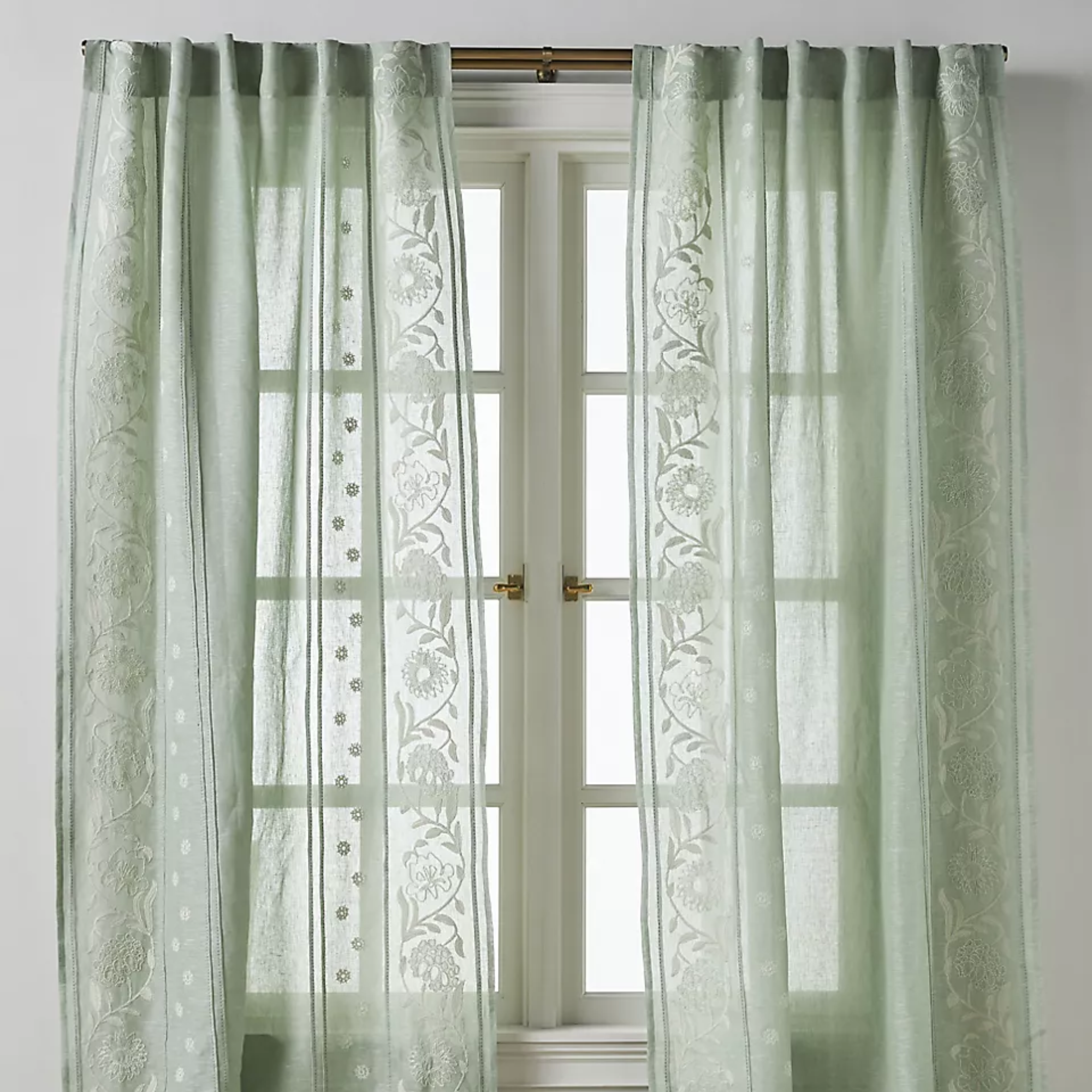 a pair of green linen curtains
