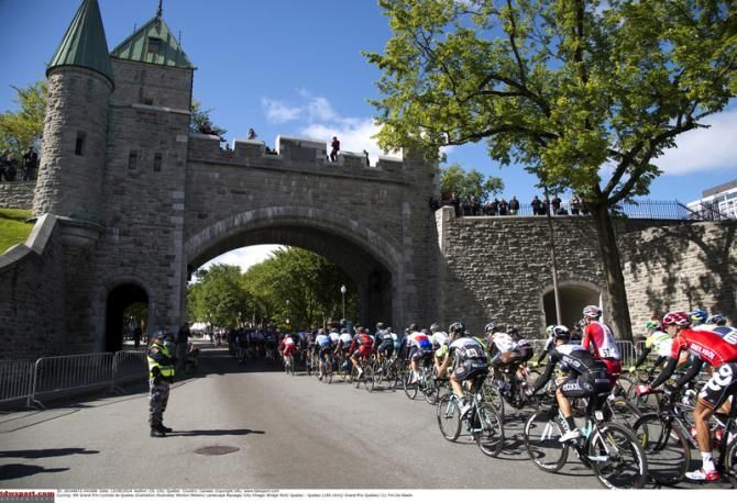 The bunch heads under one of the many bridges on the course