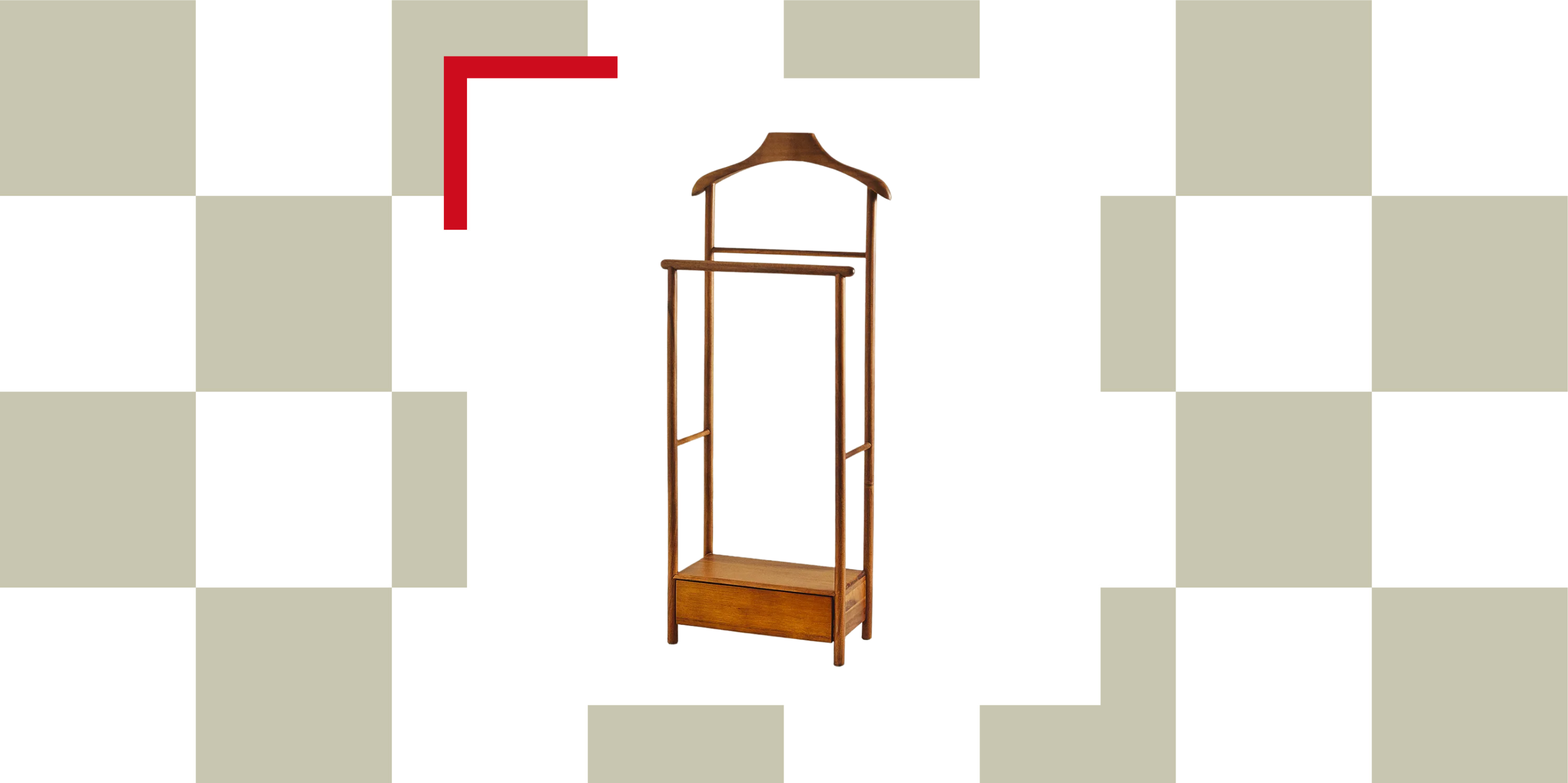 An acacia wood valet stand against a checkerboard background
