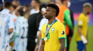 Vinicius Junior looks dejected after Brazil's defeat to Argentina in the 2021 Copa America final at the Maracana.