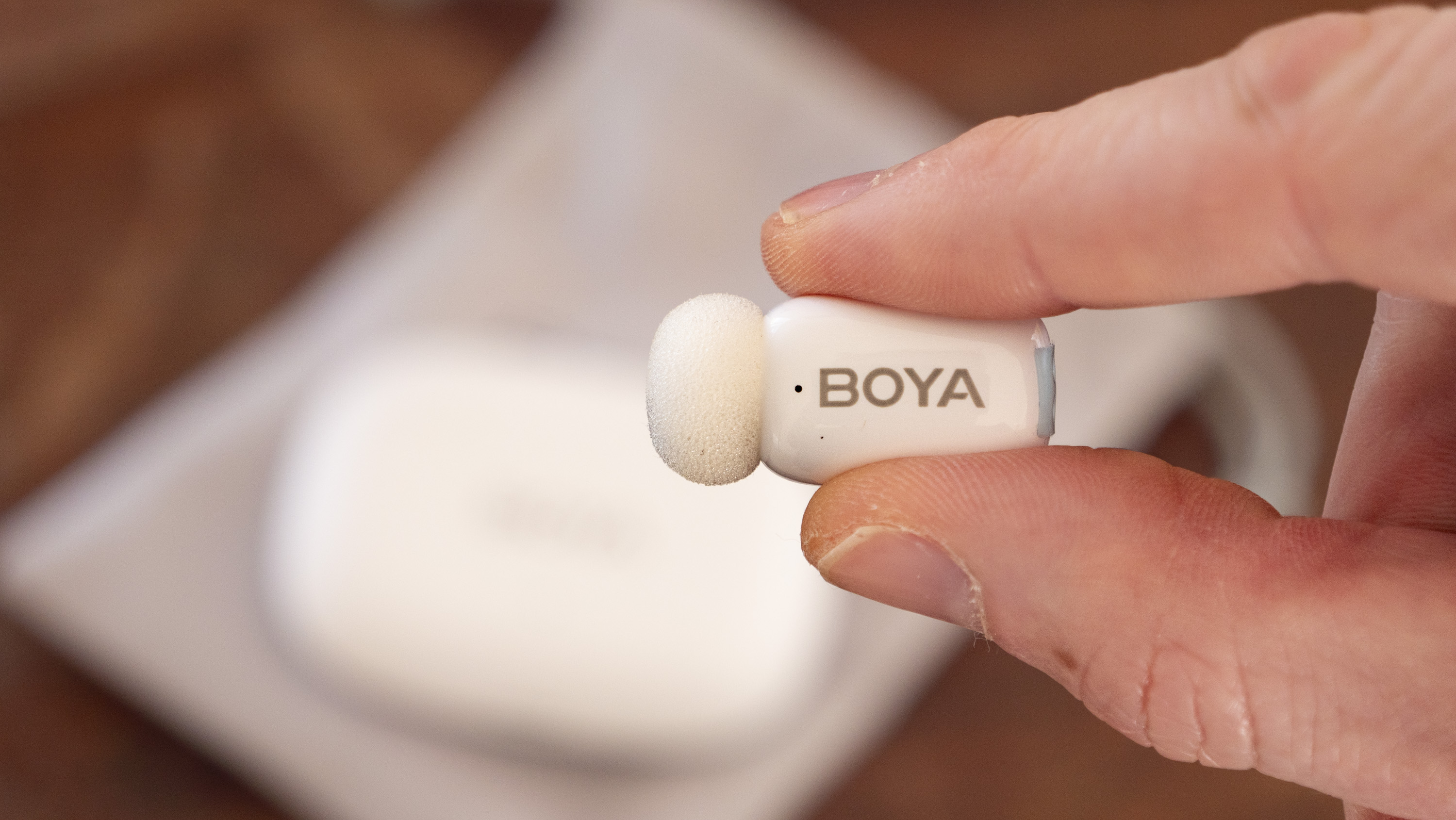 Boya Mini wireless mic in person's hand