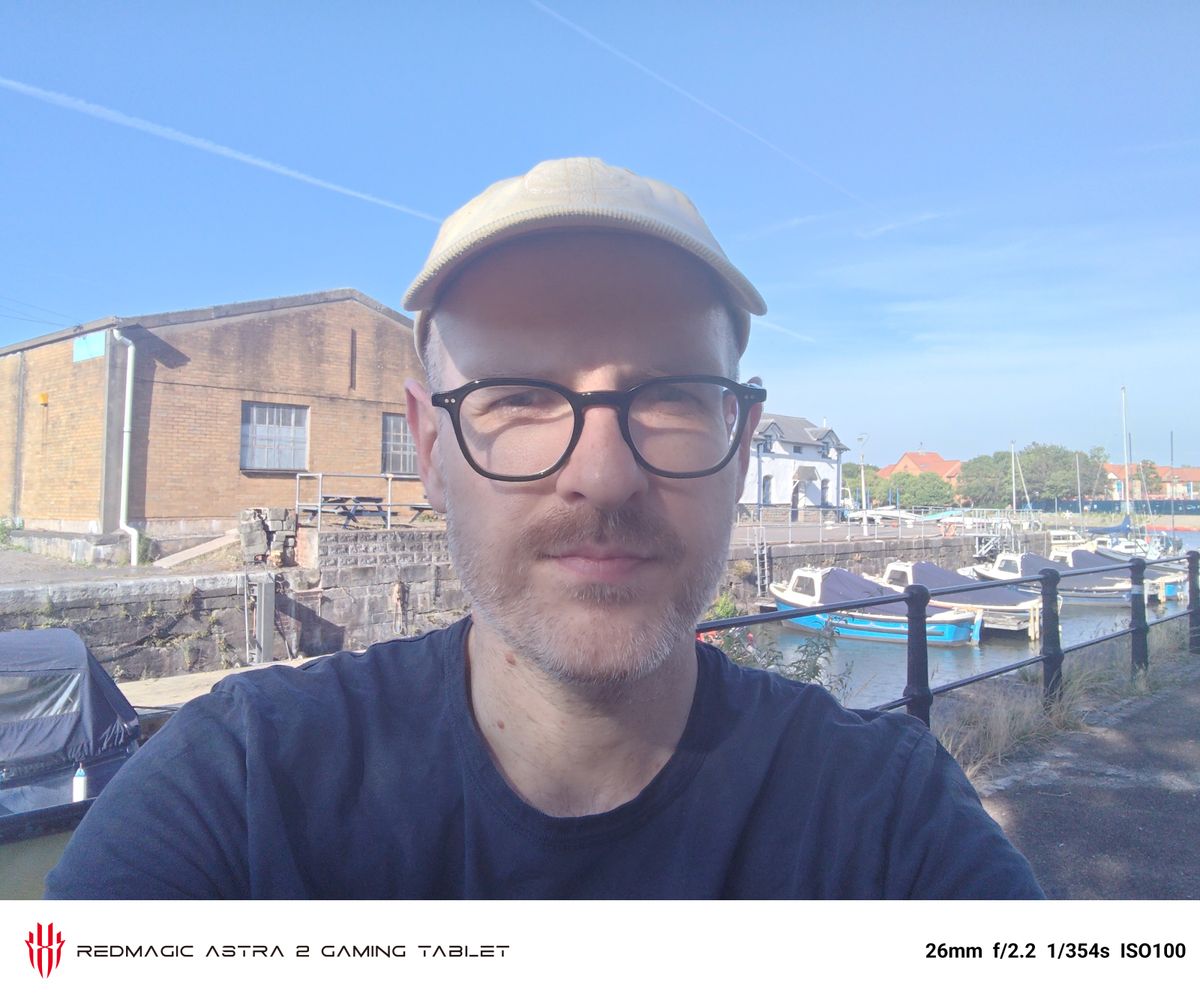 Photos of a boat and a man taken on the RedMagic Astra 2