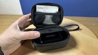 Godox WEC microphone in its nylon travel case