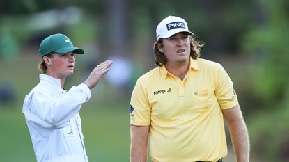 Neal Shipley takes advice from his caddie at The Masters
