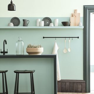 Green kitchen with open shelving