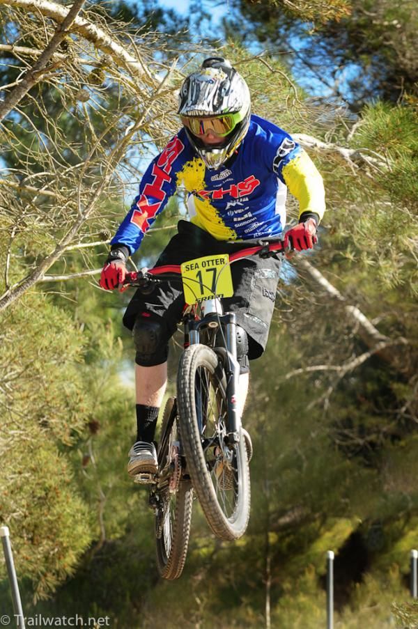 Logan Binggeli (KHS) getS up close and personal with the trees