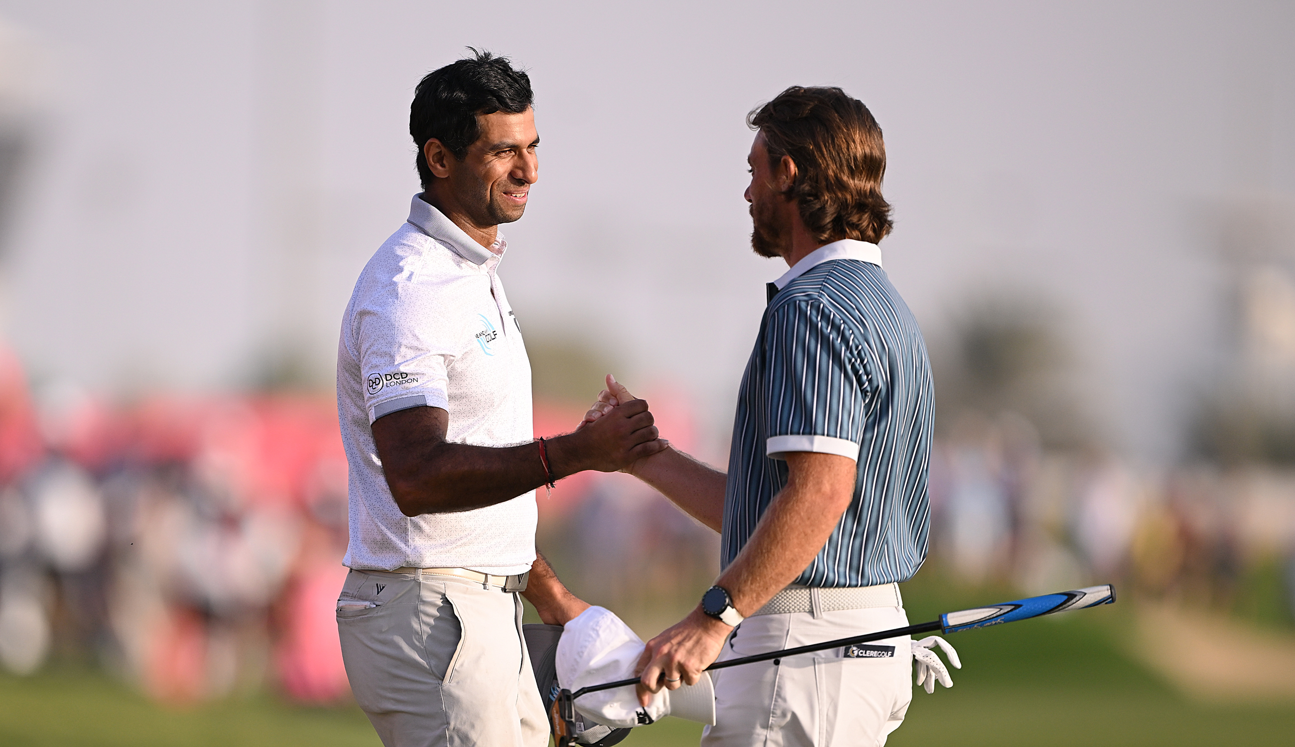Aaron Rai and Tommy Fleetwood shake hands