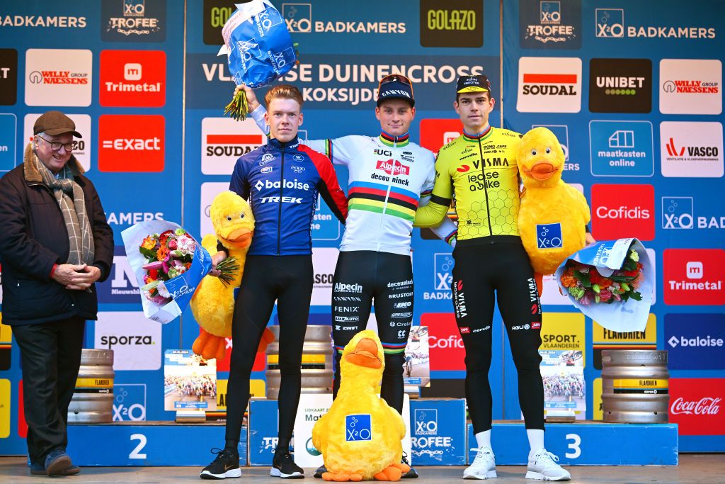KOKSIJDE BELGIUM JANUARY 04 LR Pim Ronhaar of The Netherlands and Team BaloiseTrek Lions on second place race winner Mathieu Van Der Poel of The Netherlands and Team AlpecinDeceuninck and Wout Van Aert of Belgium and Team JumboVisma on third place pose on the podium ceremony after the 17th X2O Trofee Cyclocross Vlaamse Duinencross Koksijde 2024 Mens Elite on January 04 2024 in Koksijde Belgium Photo by Luc ClaessenGetty Images