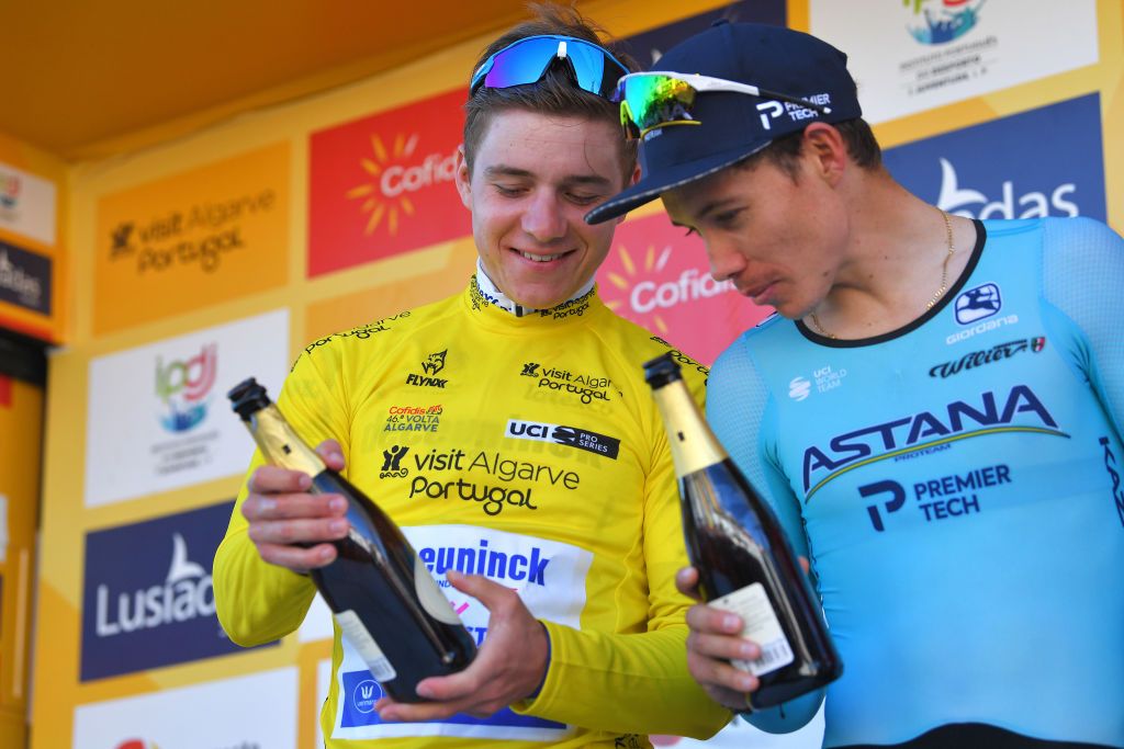 LAGOA PORTUGAL FEBRUARY 23 Podium Remco Evenepoel of Belgium and Team Deceuninck Quick Step Yellow Leader Jersey Miguel ngel Lpez of Colombia and Team Astana Pro Team Celebration Champagne during the 46th Volta ao Algarve 2020 Stage 5 a 203km Individual Time Trial stage from Lagoa to Lagoa ITT VAlgarve2020 on February 23 2020 in Lagoa Portugal Photo by Tim de WaeleGetty Images