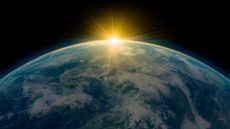 An artist's rendering of the sun rising over the earth