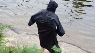 Man in black changing robe