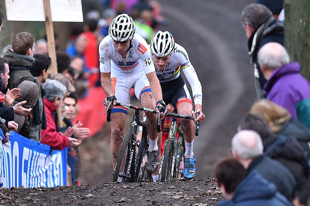Wout van Aert leads Mathieu van der Poel on the run up in Namur.