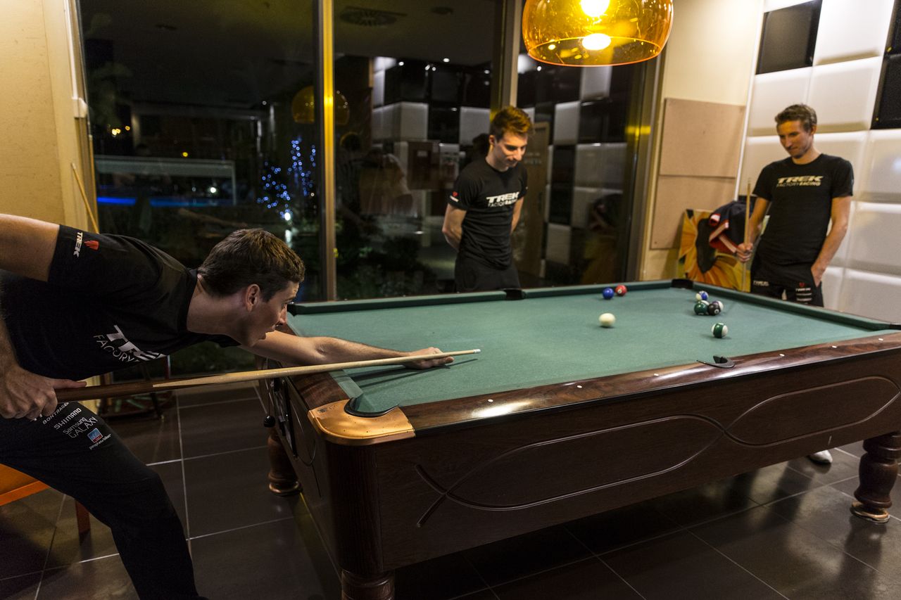 The riders play pool to relax