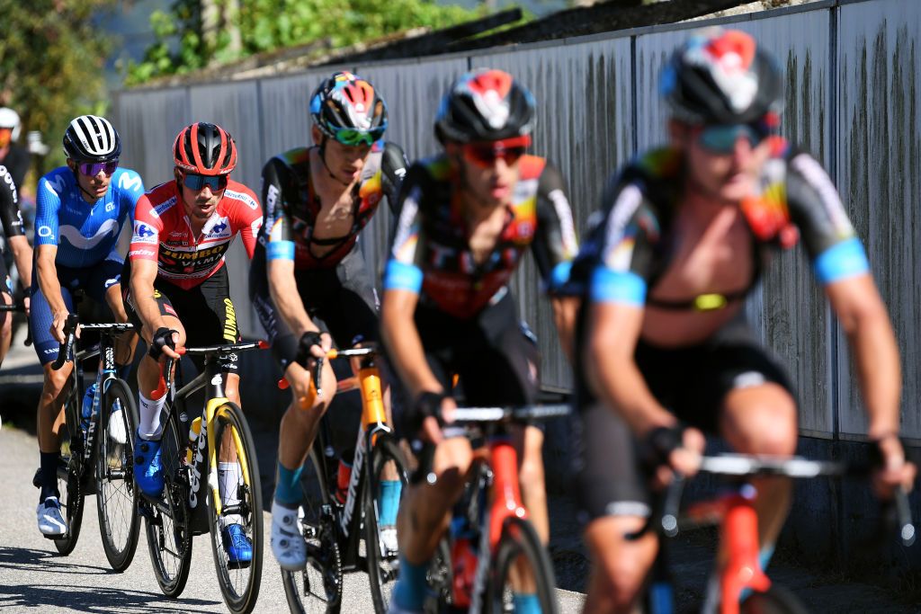 MOS SPAIN SEPTEMBER 04 LR Enric Mas Nicolau of Spain and Movistar Team and Primoz Roglic of Slovenia and Team Jumbo Visma red leader jersey compete during the 76th Tour of Spain 2021 Stage 20 a 2022km km stage from Sanxenxo to Mos Alto Castro de Herville 502m lavuelta LaVuelta21 on September 04 2021 in Mos Spain Photo by Tim de WaeleGetty Images