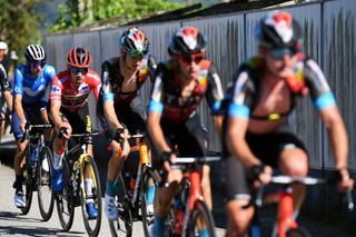 MOS SPAIN SEPTEMBER 04 LR Enric Mas Nicolau of Spain and Movistar Team and Primoz Roglic of Slovenia and Team Jumbo Visma red leader jersey compete during the 76th Tour of Spain 2021 Stage 20 a 2022km km stage from Sanxenxo to Mos Alto Castro de Herville 502m lavuelta LaVuelta21 on September 04 2021 in Mos Spain Photo by Tim de WaeleGetty Images