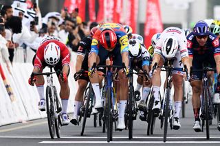 QIDFA UNITED ARAB EMIRATES FEBRUARY 20 LR Dylan Groenewegen of The Netherlands and Team Jayco AlUla Jonathan Milan of Italy and Team LidlTrek and Tim Merlier of Belgium and Team Soudal QuickStep sprint at finish line during the 7th UAE Tour 2025 Stage 4 a 181km stage from Fujairah Qidfa Beach to Umm al Quwain UCIWWT on February 20 2025 in Fujairah Qidfa Beach United Arab Emirates Photo by Dario BelingheriGetty Images