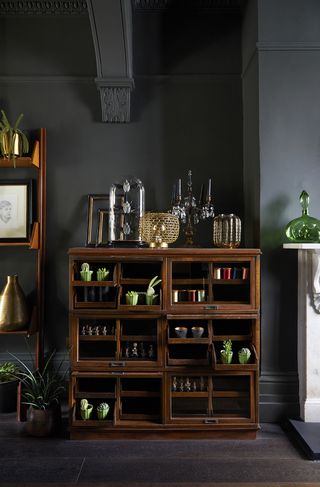 dark grey living room with wood cabinet