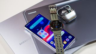 Samsung ecosystem of devices including the Galaxy S25 Ultra, Galaxy Watch Ultra, Buds 3 Pro, Samsung laptop, and Tab S10 Ultra