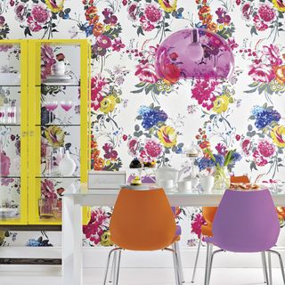 bright floral dining room with chairs