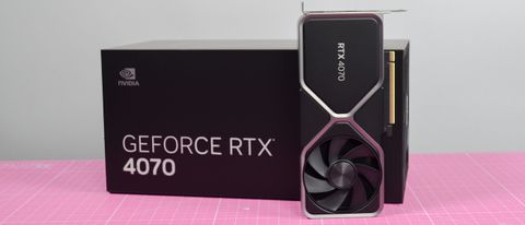 An Nvidia GeForce RTX 4070 graphics card standing upright next to its retail packaging